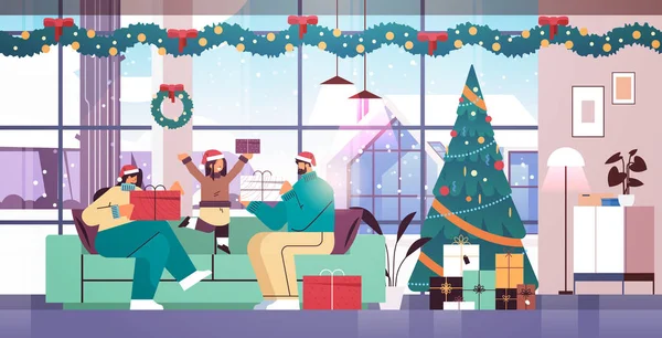 Familie in santa hoeden houden geschenken Nieuwjaar kerstvakantie viering concept woonkamer interieur — Stockvector