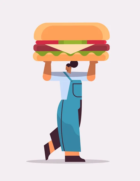Overgewicht vrouw houden hamburger junk voedsel ongezonde voeding junkfood verslaving stoppen fast food concept — Stockvector
