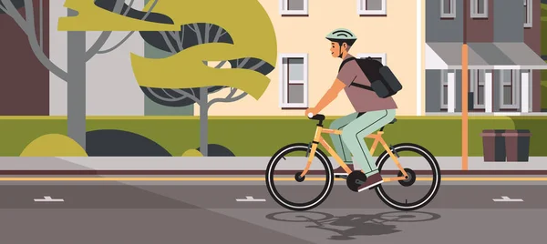헬멧을 쓰고 자전거를 타는 젊은이가 건강 한 라이프 스타일 컨셉의 도시 경관을 작업하는 모습 — 스톡 벡터