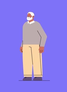 Giysiler içinde son sınıf öğrencisi. Büyükbaba ayakta duruyor. Erkek çizgi film karakteri gibi duruyor.