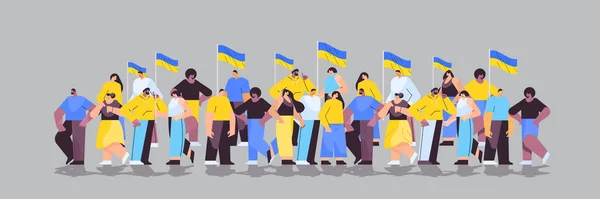 Mix race protesters holding Ukrainian flags pray for Ukraine peace save Ukraine from russia stop war concept full length — Vettoriale Stock