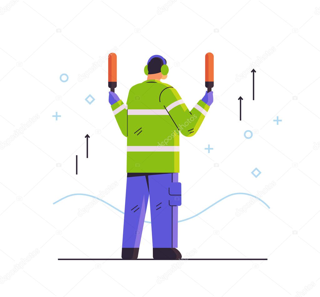 aviation marshaller supervisor signaling near aircraft air traffic controller airline worker in signal vest professional airport staff