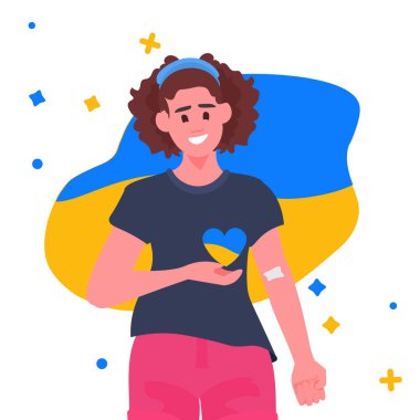 Kalbinde Ukrayna bayrağı olan gönüllü bir kadın kan bağışında bulunuyor.