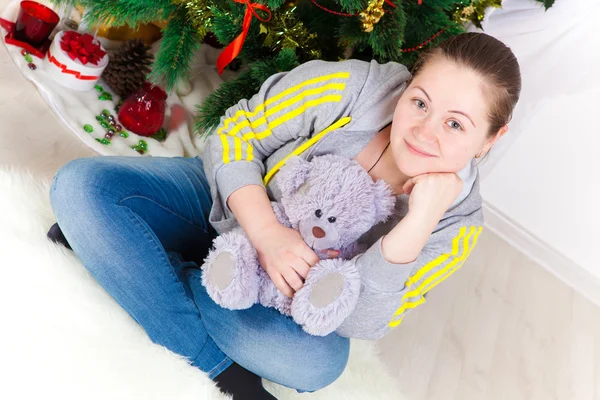 Woman with a New Year tree — Stock Photo, Image