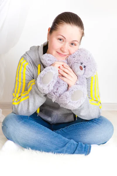 Young woman with a toy — Stock Photo, Image