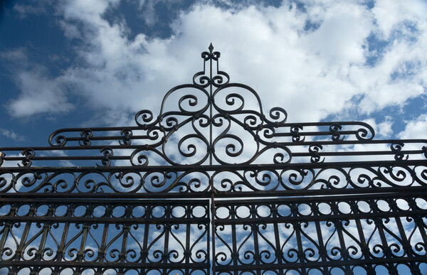 Old Wrought Iron Fence and Blue Sky