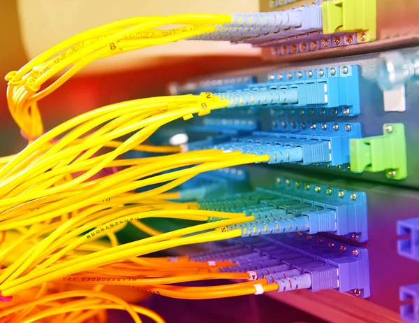 Fiber optical network cables patch panel and switch — Stock Photo, Image