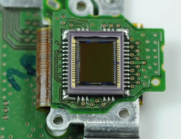 Sensore CCD su una scheda di fotocamera digitale con sfondo in fibra ottica — Foto Stock