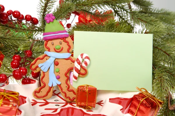 Ginger bread cookie man with christmas card — Stock Photo, Image