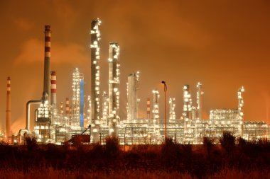 Refinery industrial plant with Industry boiler at night clipart