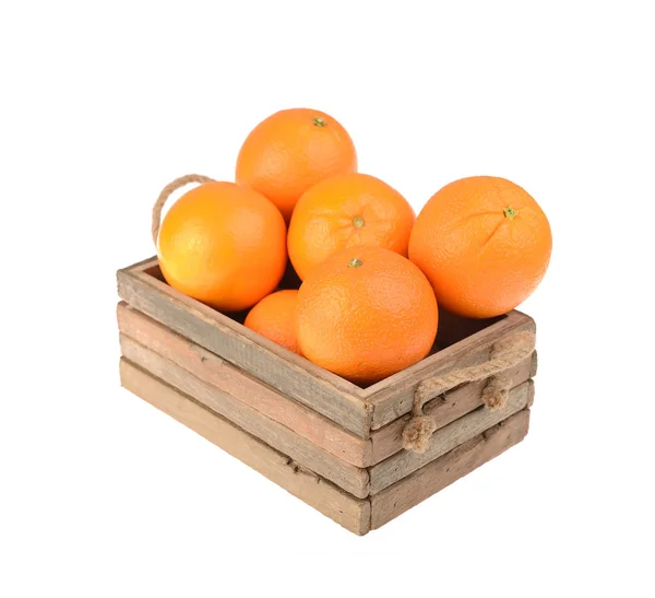 Ripe tasty tangerines with leaves in wooden box — Stock Photo, Image