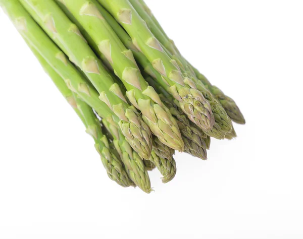 Asparagi freschi su bianco — Foto Stock