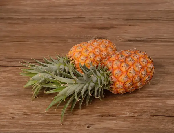 Two Pineapples on wooden grunge background — Stock Photo, Image