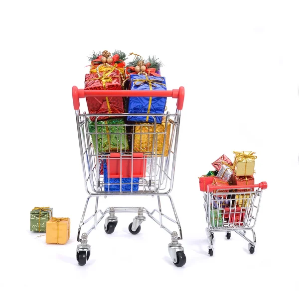 Christmas gifts in shopping cart — Stock Photo, Image