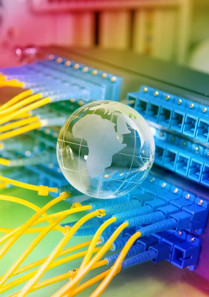 Wereld kaart technologie stijl tegen fiber optic achtergrond — Stockfoto