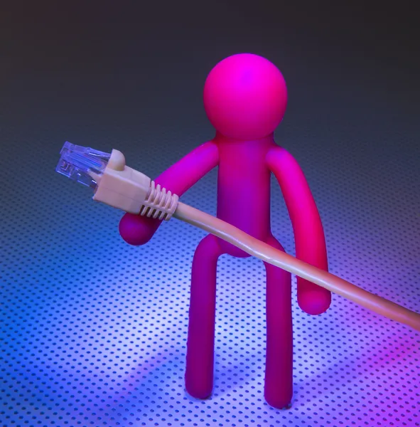 Network cable and Plastic people — Stock Photo, Image