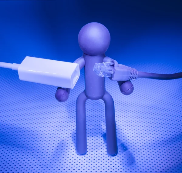 Network cable and Plastic people — Stock Photo, Image
