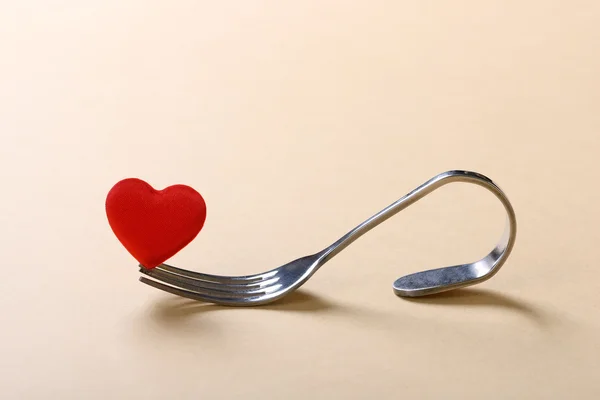 Red heart with fork on white background — Stock Photo, Image