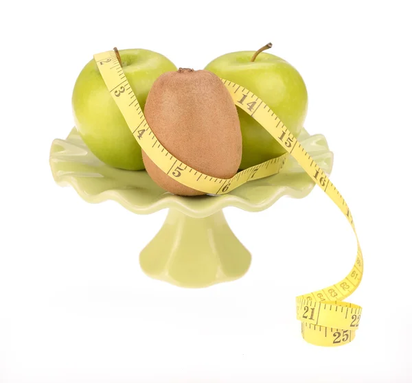 Diet concept, kiwi fruit with green apple and measuring tape — Stock Photo, Image