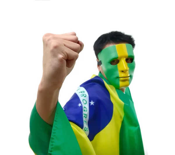 Brasilianska man firar med flagga och mask — Stockfoto