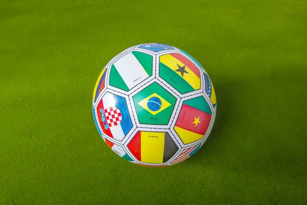 Football with flags representing all countries participating in — Stock Photo, Image