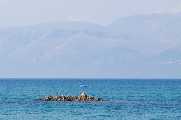 Greek flag on the islet — Stock Photo, Image