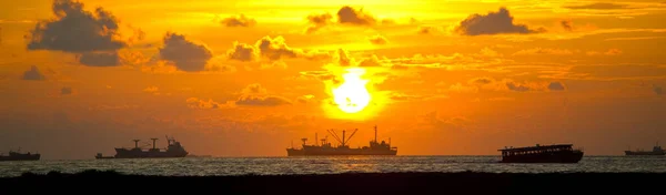 Cargo Ships Sea Backdrop Tropical Sunset — Stockfoto