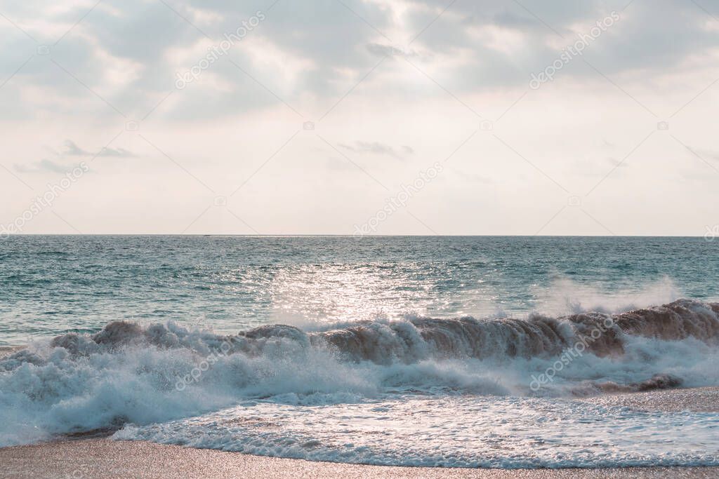 Blue wave on the beach. Dramatic natural background.