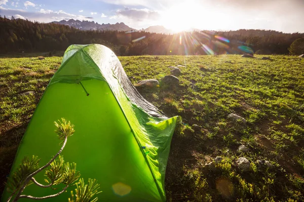 Hiking tent in the mountains in summer season