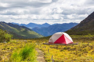 Tent in the mountains in polar tundra, Tombstone Territorial Park, Yukon, Canada. 