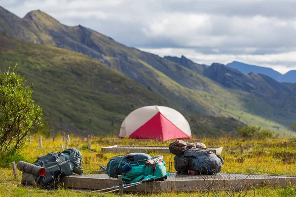 Hiking tent and backpacks in camping  in the mountains in summer season