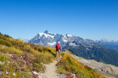 hiker in mountains on beautiful rock background