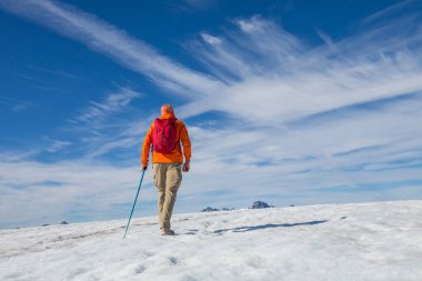 The climb in snowy mountains in the summer season