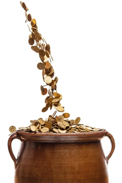 Gold coins falling in the vintage pot — Stock Photo, Image