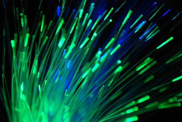 The green optical fibers with black background. — Stock Photo, Image