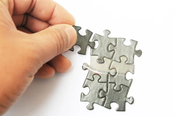 Hands with two puzzles — Stock Photo, Image