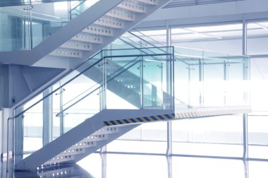 Open stairwell in a modern office building clipart