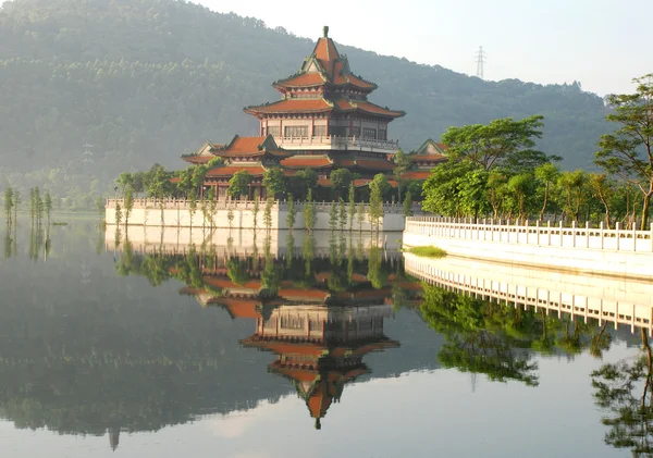 The ancient pavilion on a stone terrace in lake in an imperial chinese garden. — Stock Photo, Image