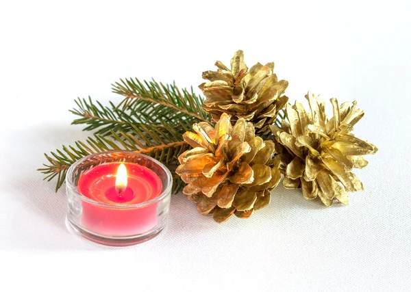 Pine cones and candle — Stock Photo, Image