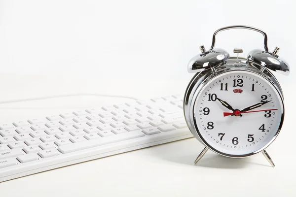 Alarm-clock in the office — Stock Photo, Image