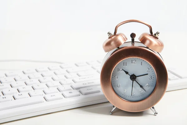 Alarm-clock in the office — Stock Photo, Image