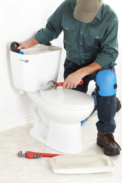 El trabajador con un émbolo — Foto de Stock