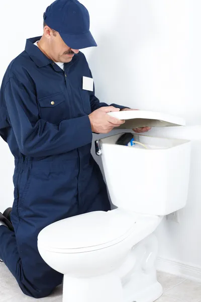 The worker and lavatory pan — Stock Photo, Image