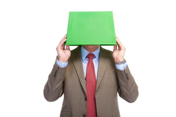 Бизнесмен с зеленой коробкой на голове — стоковое фото