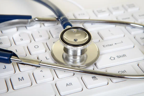 Phonendoscope and keyboard — Stock Photo, Image