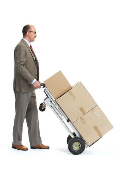 Businessman with a handcart — Stock Photo, Image