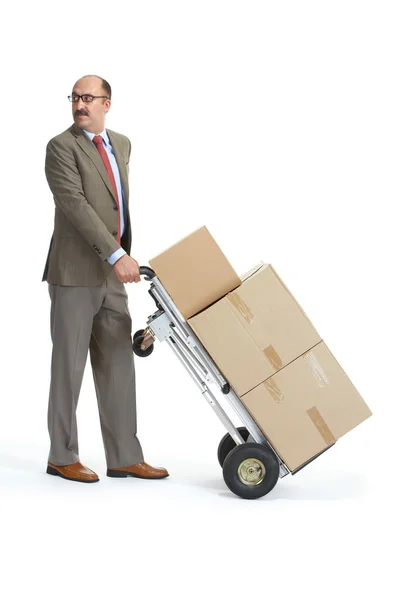 Businessman and handcart with a load — Stock Photo, Image