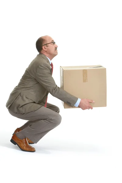 Businessman and a cardboard box — Stock Photo, Image