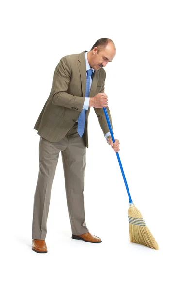 Businessman sweeps — Stock Photo, Image