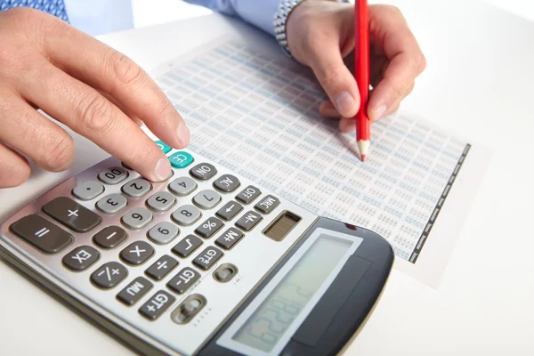 The businessman and green calculator — Stock Photo, Image